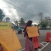 PENGALANGAN DANA - Suasana pengalangan dana yang dilakukan oleh KAMMI Daerah Gorontalo di simpang lima telaga. Ahad (17/1/2021). (Foto Istimewa)
