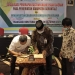 Penandatanganan Perjanjian Kerjasama yang diwakili oleh Kepala Dinas Pemerintah Desa Nawir Tondako Dan General Meneger Bank Sulut Go Cabang Limboto Yusuf Husain. (Putra/Gopos).