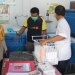 Proses Penyimpanan Vaksin Sinovac dilakukan petugas kesehatan puskesmas Limboto. (Putra/Gopos)