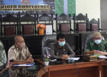 Suasana Vidio conference nasional, dalam rangka pelaksanaan kesiapan vaksinasi Covid-19 dan kesiapan penegakan Protokol Kesehatan. Foto (Putra/Gopos)