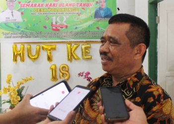 Ikbal Maku Selaku Kepala Desa Polohungo Kecamatan Tolangohula. (Putra/Gopos)