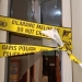 Garis polisi dipasang tepat di kaca yang pecah akibat insiden di gedung DPRD Pohuwato, Jumat (7/4/2021).