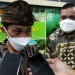 Bupati Gorontalo Nelson Pomalingo, saat diwawancarai uasai Rapat Forum Komunikasi Pimpinan Daerah (Forkopinda) Kabupaten Gorontalo, ditemani Wakil Bupati Hendra S Hemeto. (Foto: Putra?Gopos.id)