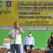 Gubernur Gorontalo Rusli Habibie saat memberikan sambutan pada pelaksanaan vaksinasi massal di lapangan indoor eks kantor gubernur lama, Kota Gorontalo, Sabtu (26/6/2021). (Foto : Istimewa)