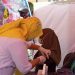 Sil Yusuf salah seorang masyarakat yang ikut divaksinasi Covid-19, di Lapangan Pesat Gatra Polres Gorontalo, Rabu (16/6/2021). (Foto: Putra/Gopos)