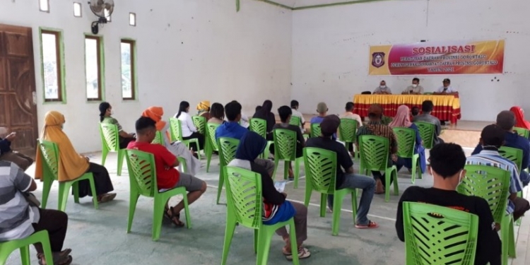 PROTKES - DPRD Provinsi Gorontalo saat melakukan sosialisasi Protkes kepada Masyarakat. Foto (Humas)