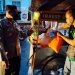 Kapolres Bone Bolango, AKBP Suka Irawanto menyerahkan bantuan sembako bagi pedagang kecil di wilayah Kota Gorontalo, Jumat (16/7/2021). (Humas Polres Gorontalo)
