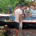 Warga Desa Sogitia mengevakuasi perahu yang rusak akibat tertimpa pohon yang tumbang, Kamis (15/7/2021). (istimewa)