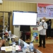Sekdaprov Gorontalo Darda Daraba saat memaparkan aplikasi berbasis web, untuk pelaporan percepatan akselerasi vaksinasi di Provinsi Gorontalo,  di depan gubernur Rusli, Forkopimda Gorontalo dan perwakilan camat, lurah dan kepala desa, Kamis (12/8/2021). Pemaparan ini sekaligus dirangkaikan dengan peluncuran aplikasi berbasis web tersebut.  (Foto  Salman)