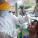 Salah seorang masyarakat yang berkunjung ke Pasar Hulawa Desa Hulawa Kecamatan Telaga Kabupaten Gorontalo di vaksinasi Covid-19, Jumat (6/8/2021). (Foto: Putra/Gopos)