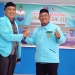 Hendrik Wakiden (kiri) bersama Hasmin (kanan) saling bersalaman usai pemilihan Ketua DPD BKPRMI Pohuwato