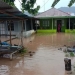 Lahan persawahan dan rumah warga tergenang banjir akibat jebolnya tanggul di Desa Bongopini Kecamatan Tilongkabila pada sore tadi. (Foto Istimewa)