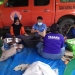 Anggota Tim Tagana dan BPBD Pohuwato menyiapkan makanan siap saji untuk diidstribusikan bagi warga terdampak banjir. (istimewa)