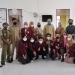 Mahasiswa program KKN Tematik UNG Desa Membangun berpose bersama aparat Desa Lambangan, Kecamatan Pagimana, Kabupaten Banggai, Senin (20/9/2021) (foto: gopos.id)