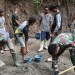 Satgas TMMD ke-112 Kodim 1304/Gorontalo bersama warga terus mempercepat pengecoran jalan rabat beton yang berada di Desa Tulabolo Kecamatan Suwawa Timur Kabupaten Bone Bolango, Minggu (19/9/2021). (Foto Istimewa)
