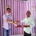 Dosen Fakultas Hukum UNG, Novendri M. Nggilu, SH., MH, menyerahkan rancangan peraturan desa tentang desa bersinar, Kamis (21/10/2021) (istimewa)