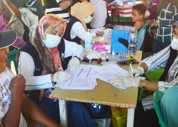 GEBYAR VAKSINASI - Pelaksanaan gebyar vaksinasi oleh MSG, Rise Manajemen. dan polres Gorontalo di wisata pemandian Pentadio Resort Desa Pentadio Barat, Kecamatan Telaga Biru, Kabupaten Gorontalo, Sabtu (18/12/2021). (Foto: Putra/Gopos)