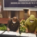 Penandatanganan NK dan RK PBPU BP Pemerintah Daerah Kabupaten/Kota se-Provinsi Gorontalo Tahun 2022 dirangkaikan rekonsiliasi iuran wajib TW IV tahun 2021 oleh Wakil Gubernur Gorontalo. Idris Rahim (Kiri) bersama Deputi Direksi BPJS Wilayah Suluttenggo, dr. Medianti Ellya Permatasari, di Hotel Aston, Kota Gorontalo, Kamis (16/12/2021). (Foto: Putra/Gopos)