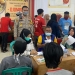 Kegiatan vaksinasi yang berlangsung hingga malam hari di wilayah Kelurahan Moodu, Kecamatan Kota Timur, Kota Gorontalo, Sabtu (11/12/2021). (Dok. Polres Gorontalo Kota)