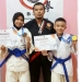 Ketua Umum (NFKI) Provinsi Gorontalo, sekaligus Ketua Komisi Teknik, Pelatihan dan Perwasitan Beladiri Kempo Indonesia Gorontalo, Muhammad Yusuf (Tengah) berfoto bersama peraih medali emas, Abdul Wafi Al Hafiz (kanan)  dan peraih medali perunggu, Nur Azizah Musa (Kiri). (Foto: Istimewa)