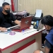 Petugas Polres Gorontalo Kota melakukan pemeriksaan terhadap RM dan SK, dua pemuda yang diamankan karena mengamuk di hotel di Kecamatan Kota Timur, Kota Gorontalo, Rabu (16/2/2022). (Polres Gorontalo Kota)