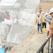 Gubernur Gorontalo Rusli Habibie saat melihat proses peledakan terowongan pengelak Bendungan Bulango Ulu, Kabupaten Bone Bolango, Senin (21/2/2022). Terowongan sepanjang 470 meter itu baru diselesaikan penggaliannya sepanjang 50 meter dengan cara diledakkan. Terowongan berfungsi mengalihkan air selama proses pembangunan bendungan. (Foto: Salman).