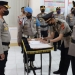 Kapolres Gorontalo AKBP Ahmad Pardomuan saat memimpin kegiatan upacara serah terima jabatan di ruang titimenga Polres Gorontalo, Rabu (23/03/2021). (Humas Polres Gorontalo)