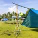 Sejumlah persiapan dilakukan masyarakat mulai dari pendirian tenda dan lapak-lapak penjualan di Lapangan Porbat, Desa Payunga, Kecamatan Batudaa, Kabupaten Gorontalo, Jumat (15/4/2022). (Foto: Putra/Gopos)
