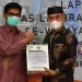 Bupati Pohuwato, Saipul Mbuinga, Menerima Dokumen Laporan Hasil Pemeriksaan BPK Perwakilan Gorontalo, Sabtu 28/05/2022 (Istimewa)