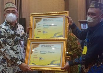 Pemkab Pohuwato Menerima Penghargaan Diberikan Langsung Oleh Plt Kepala BKN RI, Bima Haria Wibisana, Pada Jum'at 12/08/2022, di Hotel Aston Gorontalo, (Istimewa)
