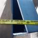 Polisi memasang garis polisi pada jendela rumah milik HM, petani di Randangan yang ditemukan tewas gantung diri, Sabtu (10/9/2022)