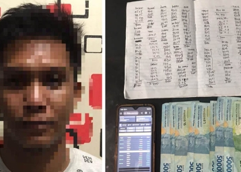 MRH pemuda 25 tahun ini, diamankan Tim Rajawali Satreskrim Polres Gorontalo Kota, bersama personil Polsek Kota Utara, diduga sebagai bandar judi togel online, Rabu (14/9/2022). (Foto: istimewa)