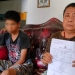 Orang tua siswa, TMRA, menunjukkan laporan kepolisian yang disampaikan terkait dugaan pengeroyokan enam orang siswa kepada anaknya, Jumat (23/9/2022) (putra/gopos)