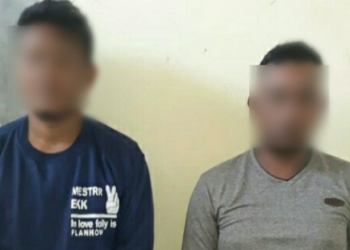 Polisi mengamankan 2 pria yang terduga pelaku pencurian kendaraan bermotor di Desa Bintauna Pantai, Kecamatan Bintauna, Kabupaten Bolaang Mongondow Utara (Bolmut). (Foto: Istimewa)
