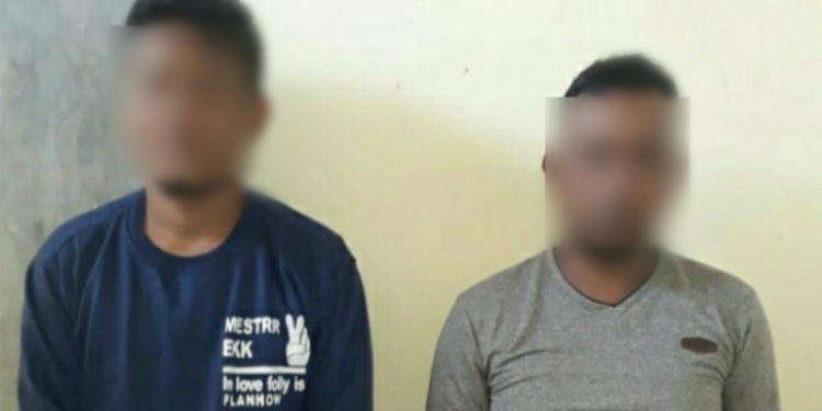 Polisi mengamankan 2 pria yang terduga pelaku pencurian kendaraan bermotor di Desa Bintauna Pantai, Kecamatan Bintauna, Kabupaten Bolaang Mongondow Utara (Bolmut). (Foto: Istimewa)