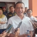 Syarif Mbuinga memberi keterangan kepada wartawan usai berkonsultasi ke KPU Provinsi Gorontalo, Ahad (25/12/2022). (hasan/gopos)
