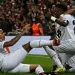 Penyerang Real Madrid Brasil Vinicius Junior (kanan) merayakan golnya bersama rekannya Rodrygo (Tengah) dan Eder Militao selama pertandingan sepak bola leg pertama babak 16 besar Liga Champions UEFA antara Liverpool dan Real Madrid di Anfield di Liverpool, Inggris pada 21 Februari 2023. Paul ELLIS / AFP