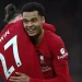 Penyerang Liverpool, Cody Gakpo (kanan) merayakan gol ke gawang Manchester United bersama penyerang Darwin Nunez pada laga Liga Inggris di Anfield, Senin (6/3/2023) dini hari WIB. [AFP]
