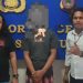 FD (tengah) diamankan Polres Pohuwato lantaran diduga mengedarkan uang palsu.(istimewa)