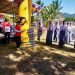 Wabup Merlan S. Uloli begitu semangat melepas lomba gerak jalan tingkat SMP dan SMA sederajat tingkat Kabupaten Bone Bolango, di Lapangan Komando, Kelurahan Tumbihe, Kecamatan Kabila, Minggu (13/8/2023). (Foto Indra/Gopos)