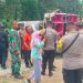 Aksi protes mahasiswa yang dikawal ketat aparat kepolisian di depan kantor Desa Polohungo, Kecamatan Tolangohula, Kabupaten Gorontalo, Kamis (7/12/2023).