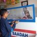 Ellen P. Tahuhe melayani transaksi keuangan nasabah di Agen BRILink miliknya yang berlokasi di Jl. Pramuka, Kelurahan Bulotadaa, Kota Gorontalo. (muhajir/gopos)