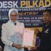 Bakal Calon Bupati Bone Bolango, Merlan S. Uloli saat mendaftarkan diri di DPD Partai NasDem Bone Bolango, Rabu (1/5/2024). (Foto Wahyudin Kadir)