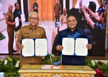 Pj Gubernur Gorontalo Rudy Salahuddin menandatangani MoU dengan Kepala BP2MI, Senin, (3/6/2024). (Foto: Nova–Kominfotik)