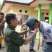 Penyematan tanda kepesertaan kepada anggota Paskibraka Kabupaten Gorontalo oleh Bupati  Gorontalo, Nelson Pomalingo.