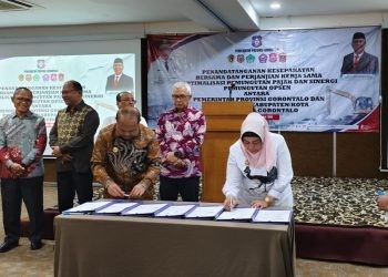 Plt Bupati Pohuwato   menandatangani nota kesepahaman sinergitas peningkatan pajak daerah bersama Pemprov Gorontalo, berlangsung di Hotel Gren Alia Senen, Jakarta, Rabu (20/11/2024).