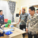 Peninjau Sentra Layanan oleh Pjs Bupati Syukri Botutihe. Foto Humas
