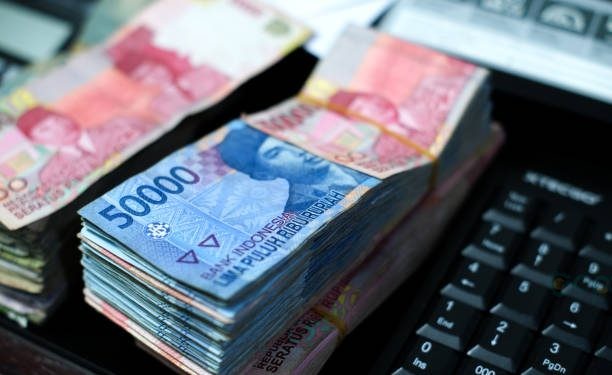 Pile of Indonesian banknotes on the desk