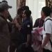 Pengunjuk rasa dan anggota saptol PP saling berhadapan saat aksi unjuk rasa di kantor Bupati Bone Bolango, Senin (17/3/2025)