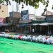 Baheri, Bareilly, Uttar Pradesh, India - September 25, 2015: Large group of people praying Namaz on Eil-al-adha, on the street.